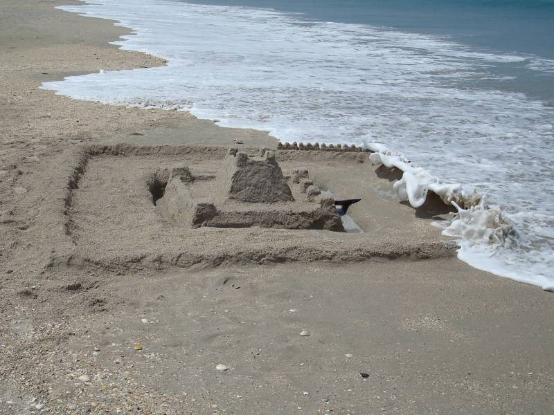 Wave Coming Over Outer Walls of Second Sandcastle