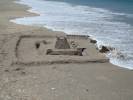 Wave Coming Over Outer Walls of Second Sandcastle